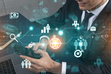 Analyst in office working with Smartphone, Searching for new technologies to boost business. Typing phone. Double exposure.の写真素材