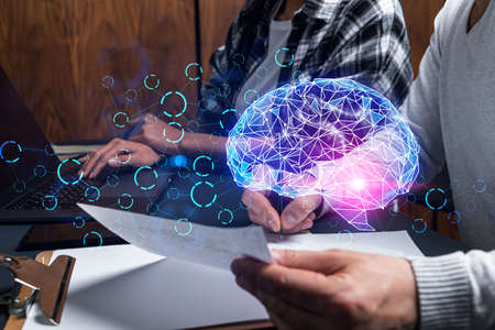 Two business people working together on IT project. Brainstorm concept. brain hologram. Double exposure.の写真素材
