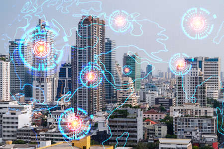 World planet Earth map hologram over panorama city view of Bangkok, Asia. The concept of...
