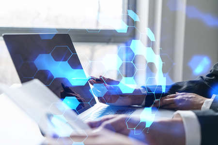 Double exposure of two people working together in high tech project. Technology hologram. Concept of...