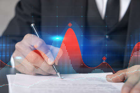 Double exposure of man sign a brokerage contract and financial chart. Success concept. Formal wear.