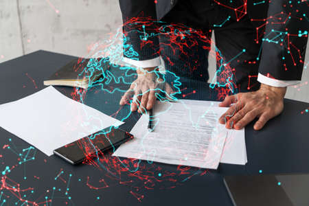 Businessman in suit signs contract. Double exposure with world map hologram. Man signing agreement...