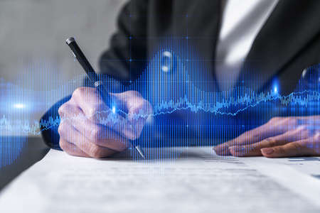 Woman signs agreement. Forex financil market chart and graph hologram. Double exposure . Brokerage...