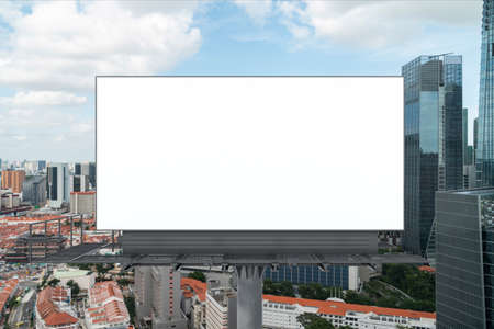 Blank white road billboard with Singapore cityscape background at day time. Street advertising poster, mock up, 3D rendering. Front view. The concept of marketing communication to promote.の写真素材