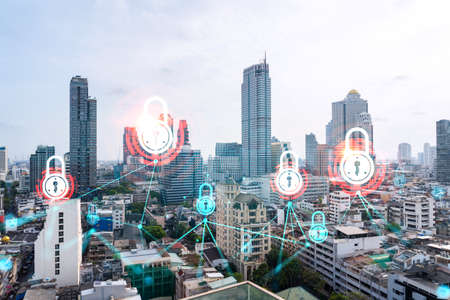 Padlock icon hologram over panorama city view of Bangkok to protect business in Asia. The concept of information security shields. Double exposure.の写真素材
