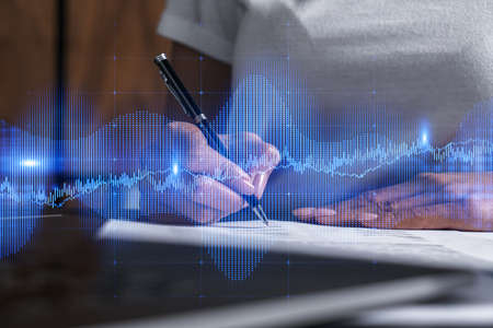 Woman signs agreement. Forex financil market chart and graph hologram. Double exposure . Brokerage...