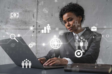 Businesswoman typing on laptop work in modern office on new project. Business icon drawing hologram....