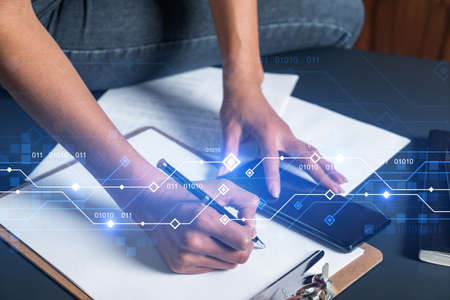 Businesswoman taking notes using smart-phone. Technology drawings double exposure.の写真素材