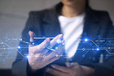Businesswoman typing phone in office. High-tech hologram. International business concept. Double...