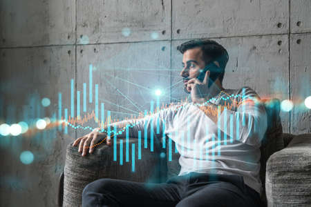 Good looking man in casual wears, talking phone, global financial market issue. Double exposure. The...