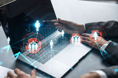 Man and woman working together on social media project. Blue infographic of people network hologram....