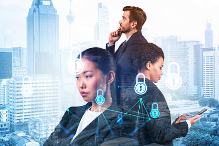 Group of business colleagues as a part of multinational corporate team working on project to protect clients information at cybersecurity compliance division. IT lock icons over Kuala Lumpurの写真素材