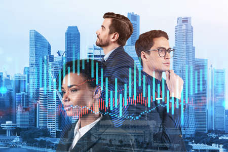 Group of business colleagues working on new venture capital and hi-tech start up and try to forecast risks and estimate prospective earning growth. Hologram chart on Singapore background.の写真素材