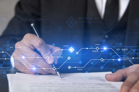 Businessman in suit signs contract. Double exposure with technology illustration hologram. New...