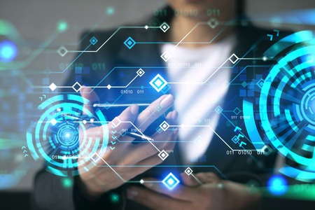 Businesswoman typing phone in office. High-tech hologram. International business concept. Double exposure.の写真素材