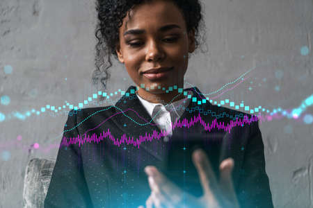 Businesswoman typing phone, work in modern office on new project. forex graph hologram. Double exposure. Concept of success in online trading. Mobile app.の写真素材