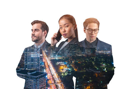 Double exposure of three young, successful, business people, man and woman, standing in front of...