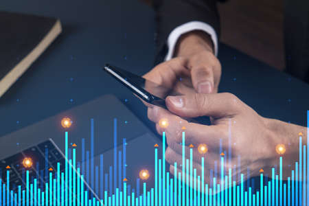 Businessman search and analyze using on-line app on phone. Financial graph hologram.