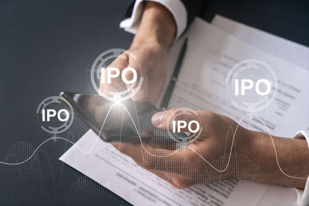 Businessman search and analyze using on-line app on phone. IPO theme hologram.の写真素材