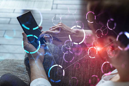Double exposure. Abstract technology theme drawing hologram. A man typing mobile phone.