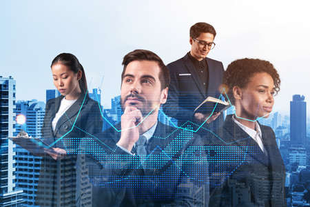 Group of business colleagues in suits as a part of multinational corporate team working on forecasting trading corporate strategy at fund. Forex chart. Bangkok on background. Double exposureの写真素材