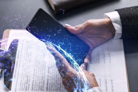 Businesswoman using smart phone in office. Abstract drawing hologram. Double exposure.