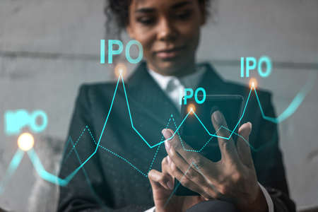 Businesswoman using phone, work in modern office on new project. IPO hologram. Double exposure....