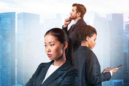 Group of three business colleagues in suits dreaming about new career opportunities after MBA graduation. Concept of multinational corporate team. Singapore on background. Double exposure.の写真素材