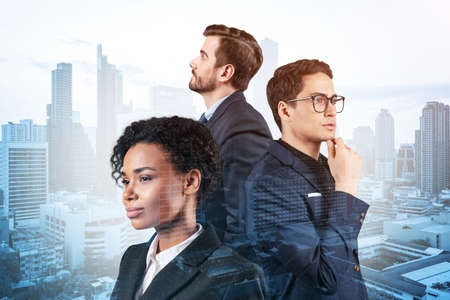 Group of three business partners in suits dreaming and looking for new opportunities to succeed. Concept of multinational corporate team. Bangkok on background. Double exposure.の写真素材