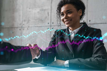 Two woman handshake. forex market concept Financial graph hologram. Multiexposure. International...