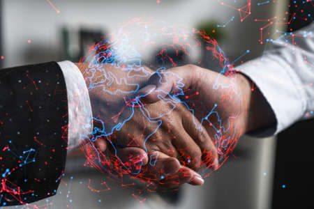 Double exposure of two businesspeople handshake and globe the earth hologram drawing background. Concept of international business. Formal wear.の写真素材