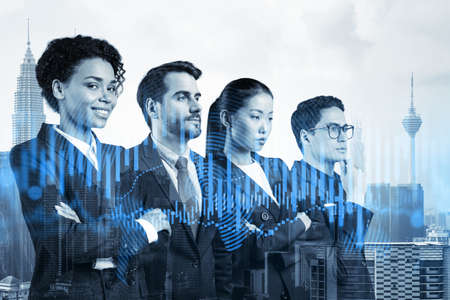 Group of business colleagues in suits as a part of multinational corporate team working on forecasting trading corporate strategy at fund. Forex chart. Kuala Lumpur on background. Double exposureの写真素材