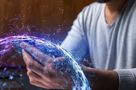 Man using phone. Hands typing smartphone. Double exposure with abstract tech network hologram. Close...