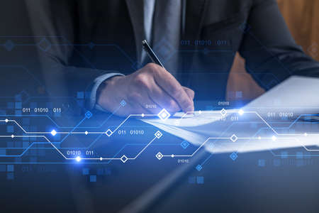 Businessman in suit signs contract. Double exposure with technology illustration hologram. New...
