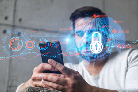 A man typing mobile phone. Double exposure. Lock icon hologram. Protection of data information...