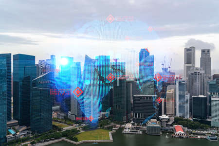 World planet Earth map hologram over panorama city view of Singapore, Asia. The concept of international connections and business. Multi Exposure.の写真素材