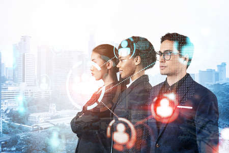 Group of SMM specialists working on social media marketing strategy to achieve business goals. Hologram icons over Kuala Lumpur background.の写真素材