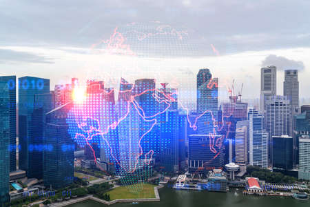 World planet Earth map hologram over panorama city view of Singapore, Asia. The concept of...