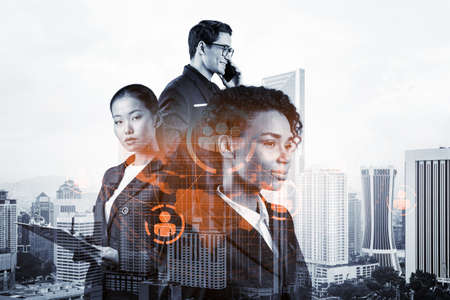 Group of SMM specialists working on social media marketing strategy to achieve business goals. Hologram icons over Kuala Lumpur background.の写真素材