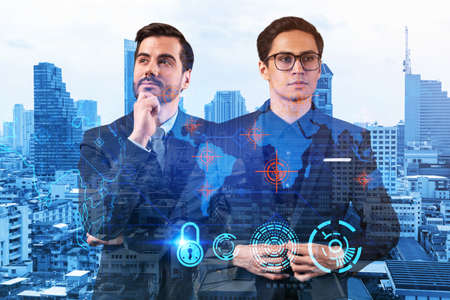 Two handsome businessman in suits thinking about career opportunities at cybersecurity compliance division to protect clients confidential information. IT lock icons over Bangkok background.の写真素材
