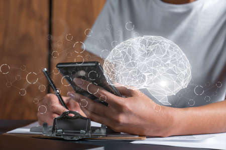 Human brain drawing and a woman signing contract use phone. Double exposure.