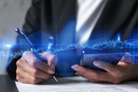 Forex chart drawing and a woman signing contract use phone. Multiexposure. Financial analysis...