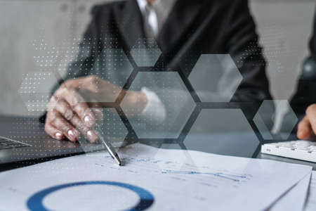Man and woman working together on high tech project. Blue info graphic abstract hologram drawings....
