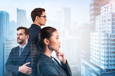 Group of three business colleagues in suits dreaming about new career opportunities after MBA graduation. Concept of multinational corporate team. Bangkok on background. Double exposure.の写真素材