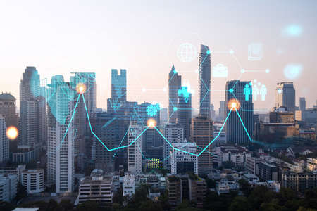 Hologram of Research and Development glowing icons. Sunset panoramic city view of Bangkok. Concept of innovative technologies to create new services and products in Asia. Double exposure.の写真素材