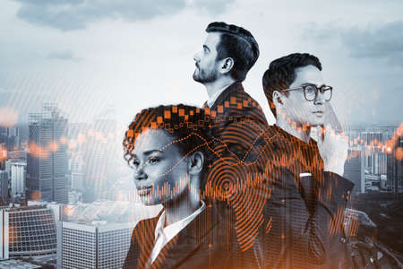 Group of business colleagues working on new venture capital and hi-tech start up and try to forecast risks and estimate prospective earning growth. Hologram chart on Singapore background.の写真素材