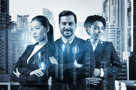 Group of SMM specialists working on social media marketing strategy to achieve business goals. Hologram icons over Bangkok background.の写真素材