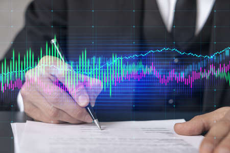 Double exposure of man sign a brokerage contract and financial chart. Success concept. Formal wear.