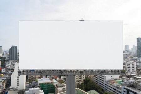 Blank white road billboard with Bangkok cityscape background at day time. Street advertising poster,...