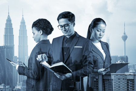 Group of three business colleagues in suits working on project together to gain new career...